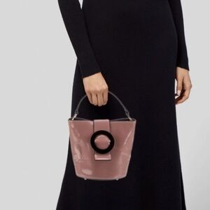 Les Petits Jouers pink and black bucket crossbody.